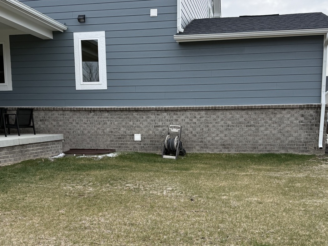 Backyard before Ridgeworks Construction outdoor living space build — McCordsville, IN