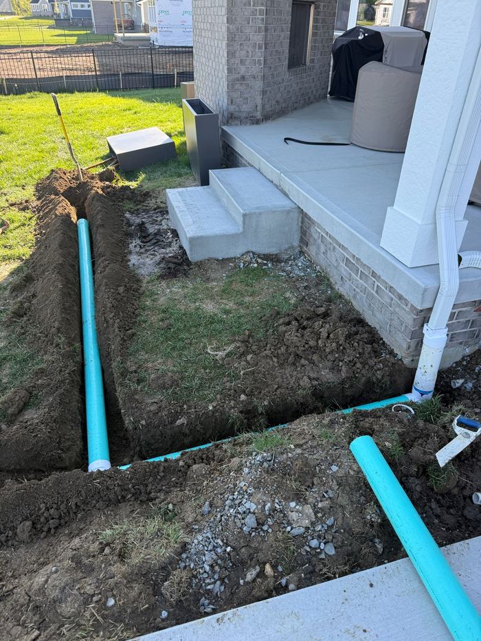 Downspout and irrigation tie-in trenching